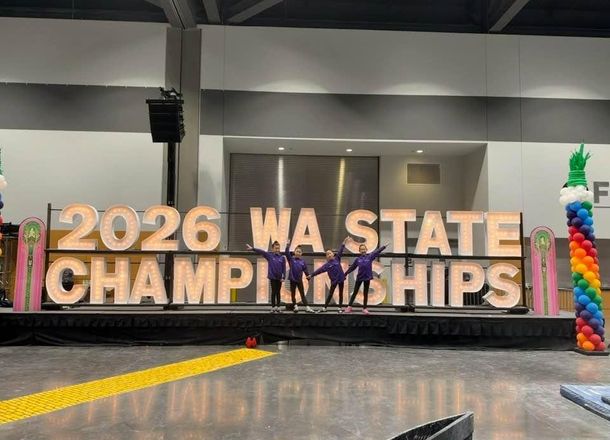 Gymnastics East team athletes celebrating at state championships